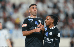 حمد الله ينهي غياب 3 مباريات.. ويواصل مطاردة السومة
                                                2025.11.23 | 08:21 pm
                                                أنهى المغربي عبد الرزاق حمد الله، مهاجم فريق الشباب الأول لكرة القدم، غيابه عن التسجيل في ثلاث مباريات ضمن دوري روشن السعودي بعد أن سجل هدفًا في شباك الأخدود خلال اللقاء الذي جمعهما، الأحد، ضمن الجولة التاسعة، وانتهى  ...